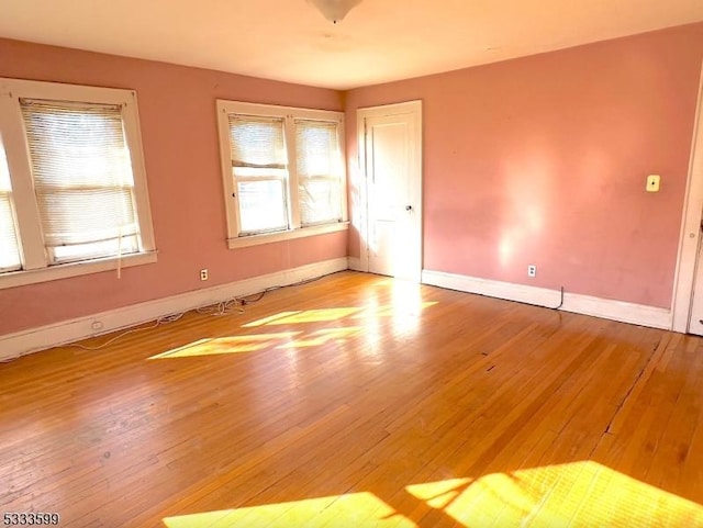 spare room featuring light hardwood / wood-style floors