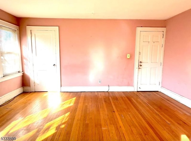 unfurnished room with light hardwood / wood-style floors