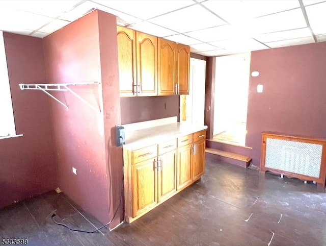 laundry area with radiator