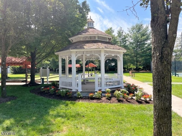 surrounding community with a gazebo and a lawn