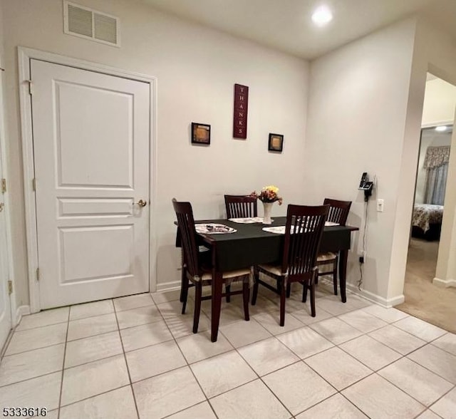 dining space with light tile patterned floors