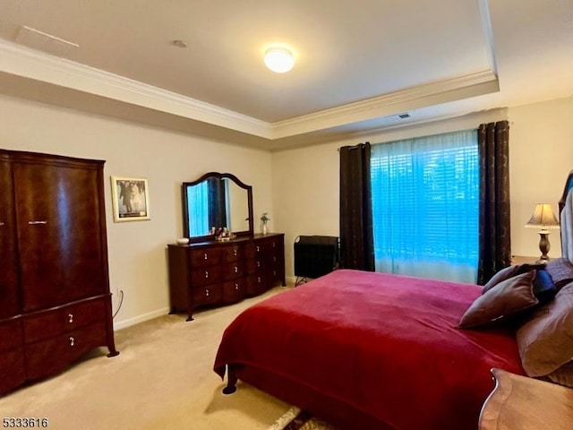 carpeted bedroom featuring a raised ceiling and crown molding