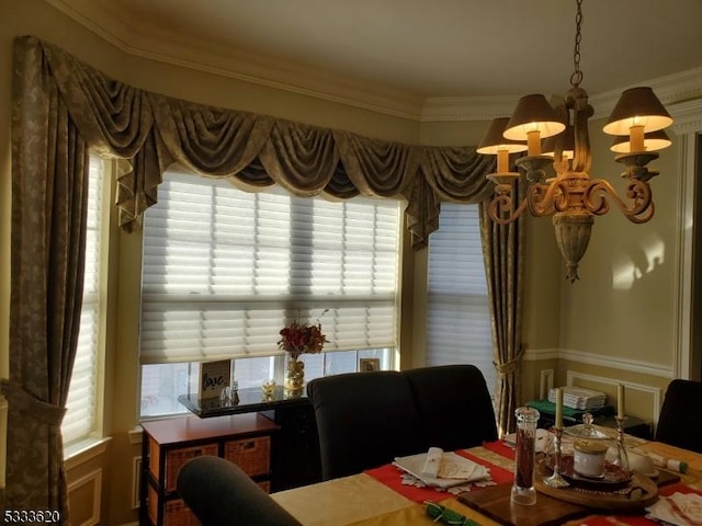 dining room featuring an inviting chandelier and ornamental molding