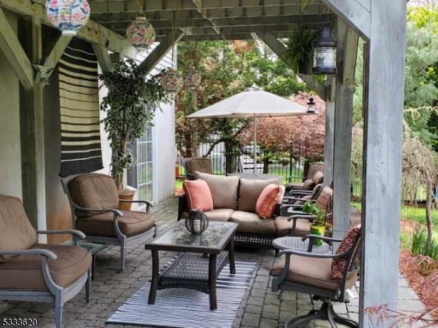 view of patio with an outdoor hangout area and a pergola