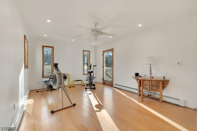 workout room featuring recessed lighting, light wood-style flooring, baseboard heating, and ceiling fan