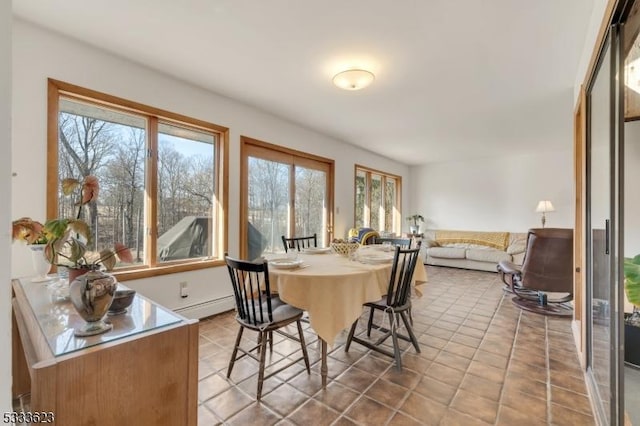 dining room featuring tile patterned floors and a baseboard radiator