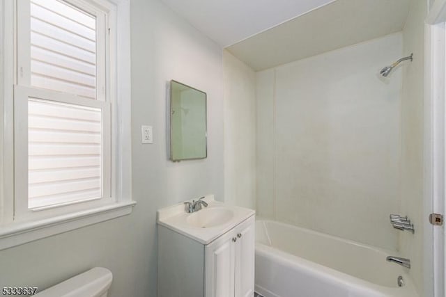 full bathroom featuring plenty of natural light, toilet, shower / tub combination, and vanity