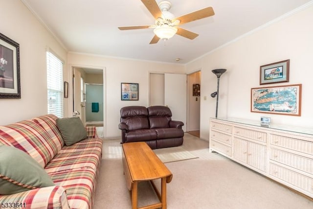 living room featuring crown molding, light carpet, and ceiling fan