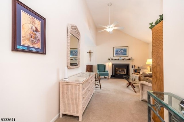 carpeted living room featuring high vaulted ceiling and ceiling fan