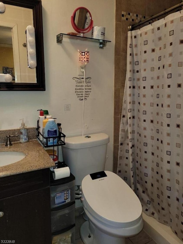 bathroom featuring vanity, toilet, and walk in shower