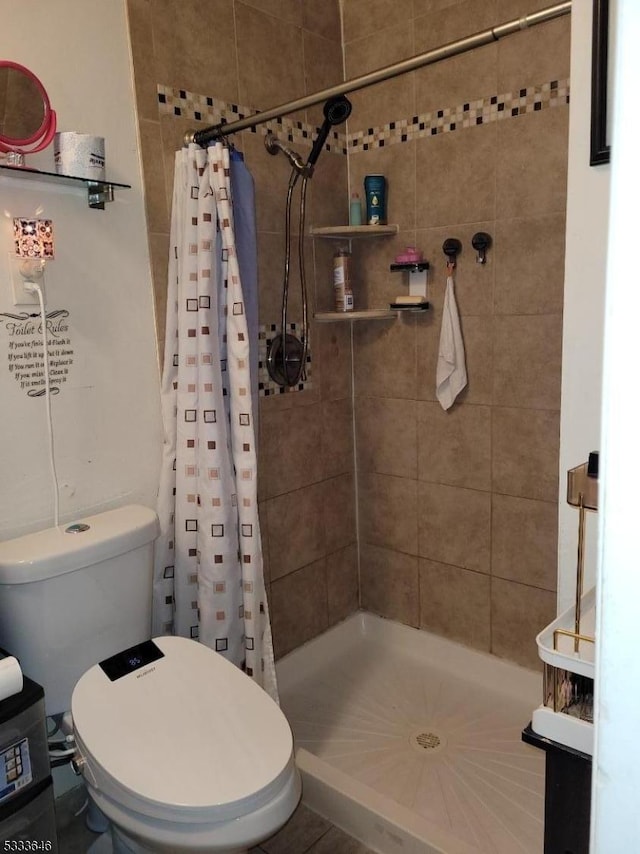 bathroom with toilet and curtained shower