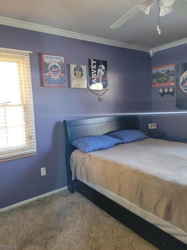 bedroom with ceiling fan, ornamental molding, and carpet flooring