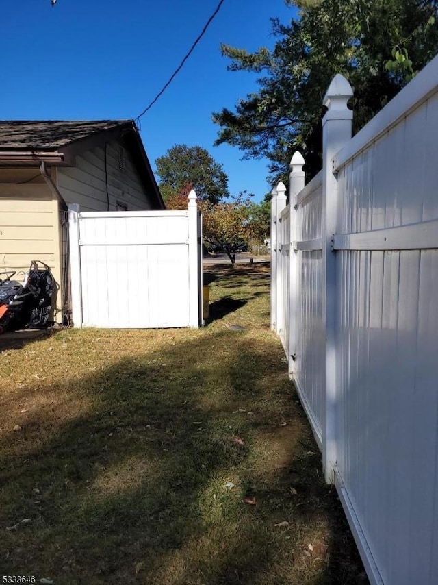 view of property exterior with a yard