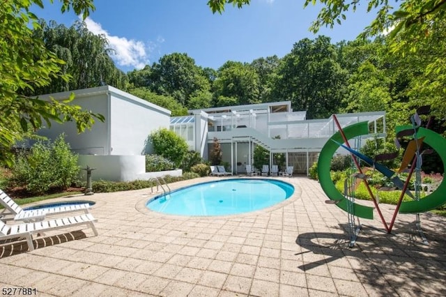 view of pool featuring a patio