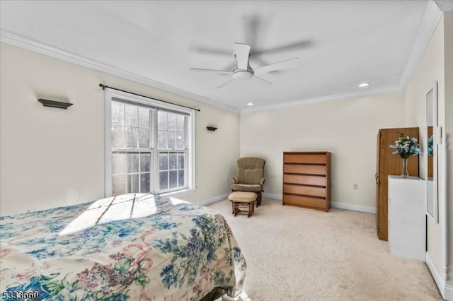 bedroom featuring crown molding, light colored carpet, and ceiling fan