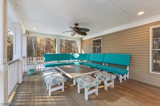 sunroom featuring ceiling fan