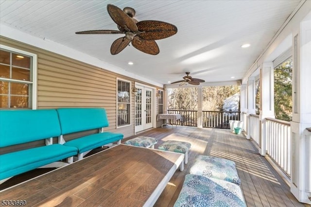 wooden terrace featuring ceiling fan