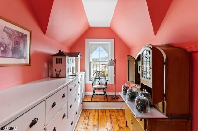 interior space with vaulted ceiling and light wood-type flooring