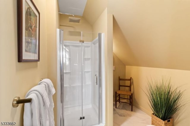 bathroom with lofted ceiling and a shower with shower door