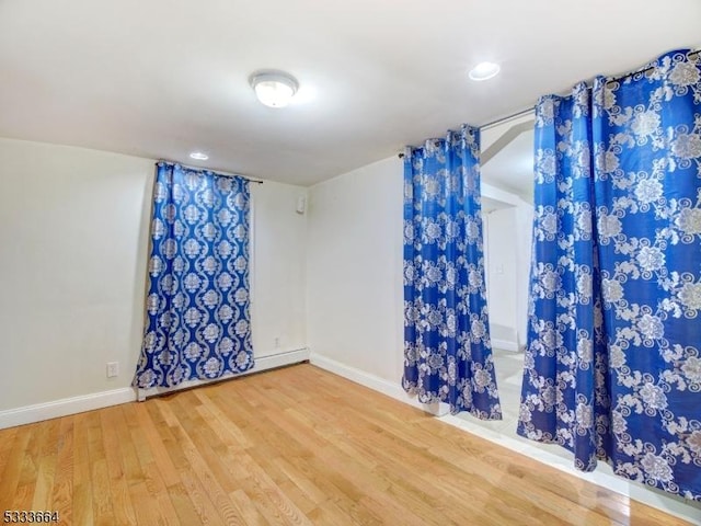 unfurnished room featuring hardwood / wood-style floors