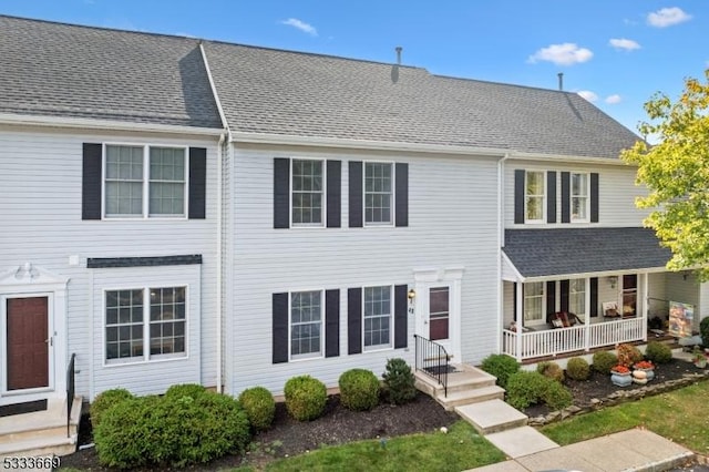 view of front of house featuring entry steps and roof with shingles