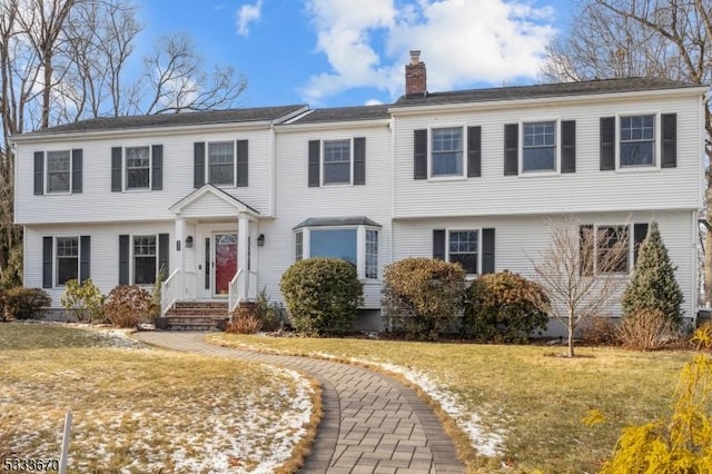 view of front of home with a front yard