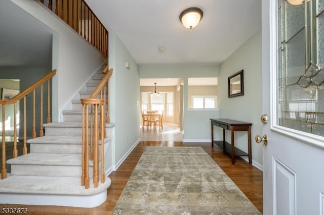 entryway with hardwood / wood-style flooring