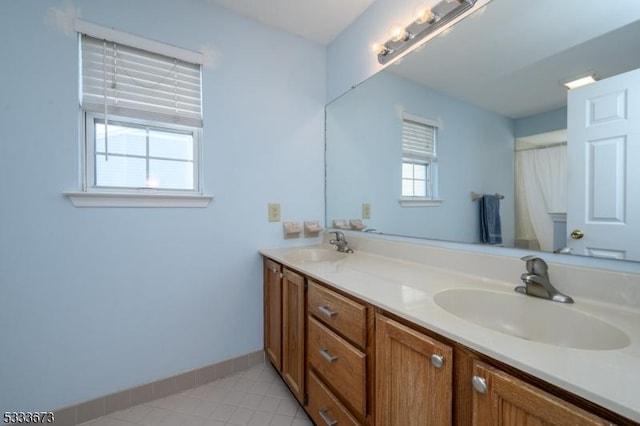 bathroom featuring tile patterned flooring and vanity