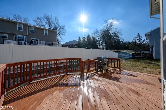 wooden deck featuring grilling area