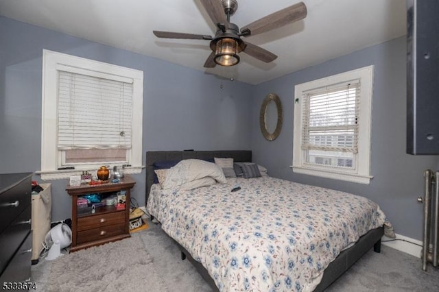 bedroom featuring ceiling fan and light colored carpet