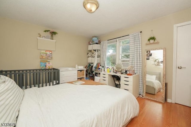 bedroom with light wood-style flooring