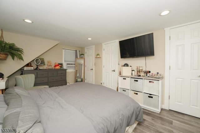 bedroom with recessed lighting and light wood-type flooring