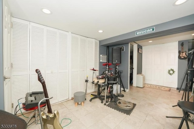 workout room featuring recessed lighting