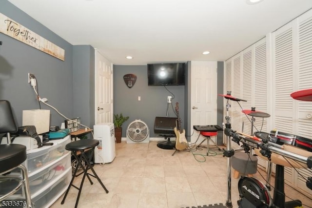 workout room featuring light tile patterned flooring, recessed lighting, and baseboards