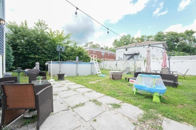 view of patio / terrace featuring a fenced in pool and fence