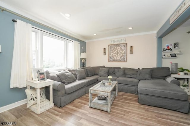 living area with recessed lighting, light wood-style flooring, baseboards, and ornamental molding