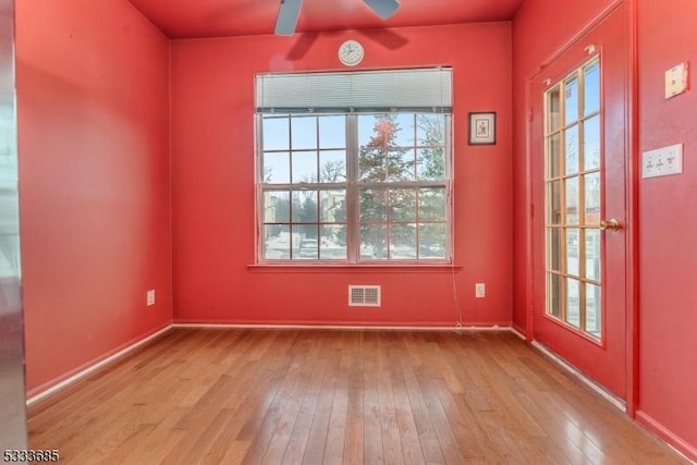 spare room featuring ceiling fan and light wood-type flooring