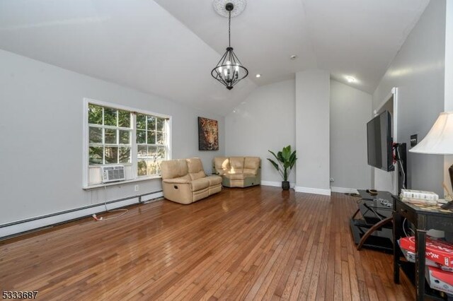 living area featuring hardwood / wood-style flooring, an inviting chandelier, a baseboard heating unit, cooling unit, and vaulted ceiling