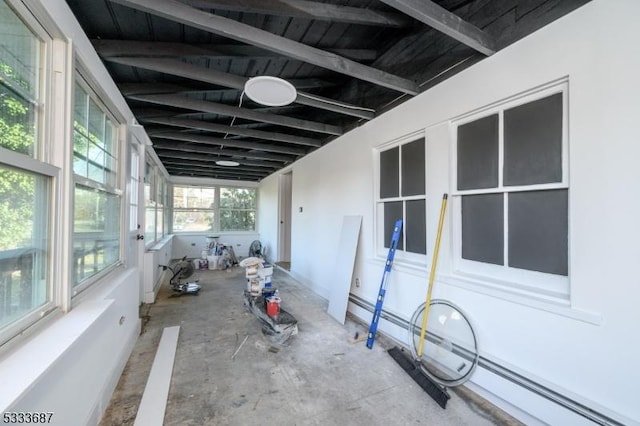 unfurnished sunroom with a baseboard radiator