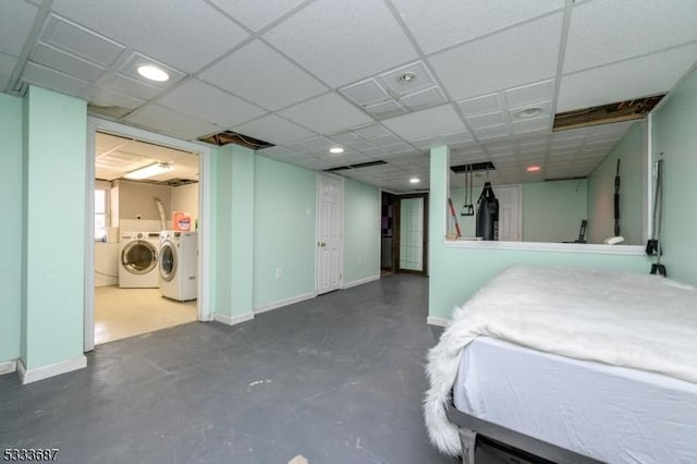 bedroom with washing machine and dryer and ensuite bathroom