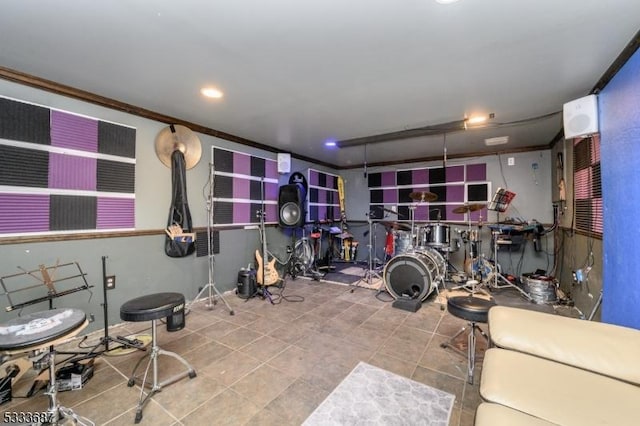 exercise room featuring ornamental molding