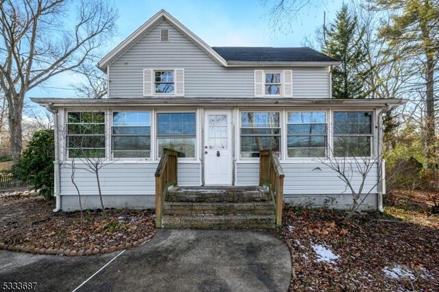 view of front of house with a sunroom