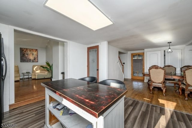 dining space featuring dark wood-type flooring