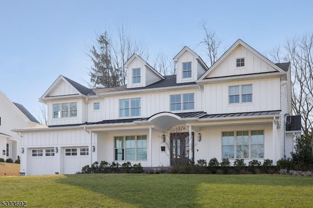 view of front of property featuring a garage and a front yard