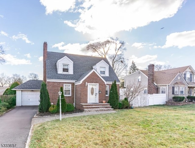 cape cod home featuring a front lawn and a garage