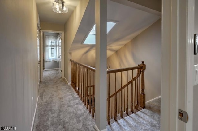 hall with light colored carpet