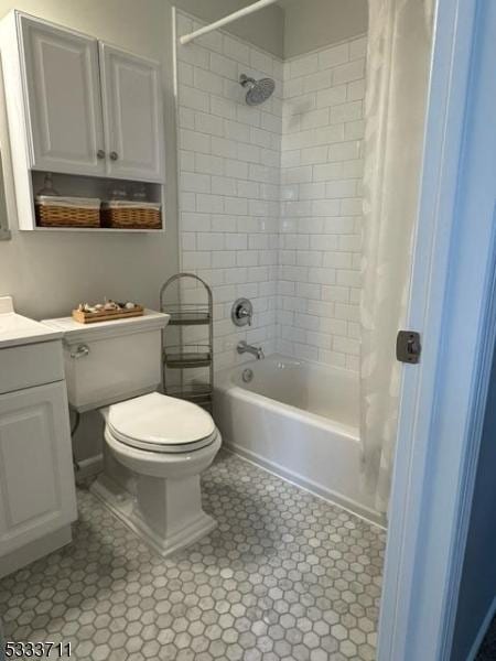 full bathroom with vanity, toilet, and shower / bath combo with shower curtain