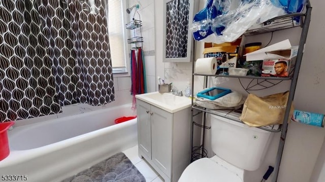 full bathroom featuring toilet, vanity, backsplash, and shower / washtub combination