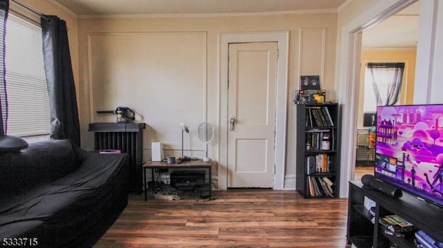 interior space featuring dark hardwood / wood-style floors and ornamental molding