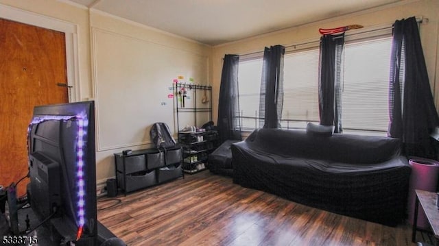 bedroom featuring dark hardwood / wood-style flooring and crown molding